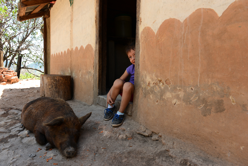 Cerro Colorado, Nicaragua. Daughter and the family pig.