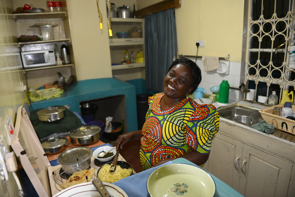 Lydiah teaching me to make ugali, the traditional dish of water and corn flour